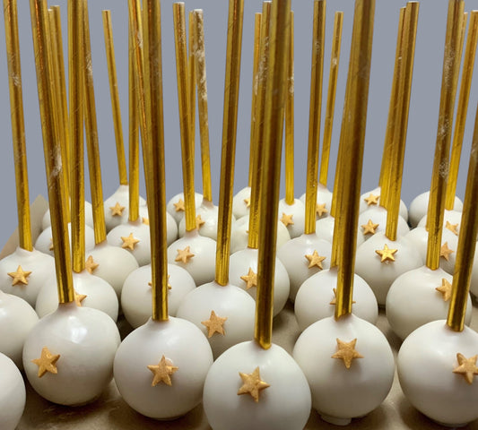 Sarah's Cakes white cake pops with gold star decorations and gold sticks, sold by the dozen.